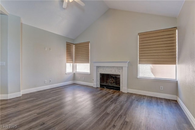 8300 Slate Harbor Cir, Las Vegas, NV 89128 - unfurnished living room with ceiling fan, vaulted ceiling, a fireplace, wood finished floors, and baseboards