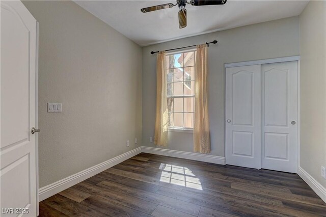 8300 Slate Harbor Cir, Las Vegas, NV 89128 - spare room featuring ceiling fan, dark wood-type flooring, and baseboards