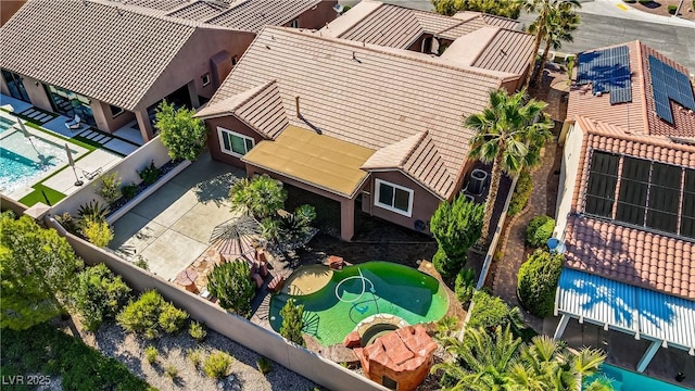 view of subject property with a pool