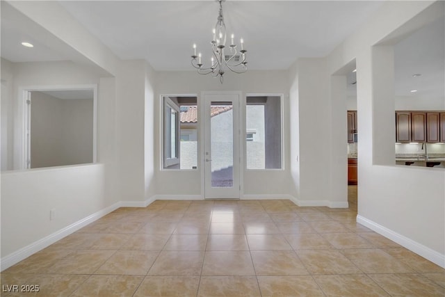 unfurnished dining area featuring a chandelier, light tile patterned floors, baseboards, and recessed lighting