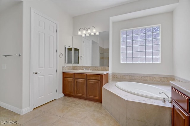 full bath with a garden tub, a stall shower, vanity, and tile patterned flooring