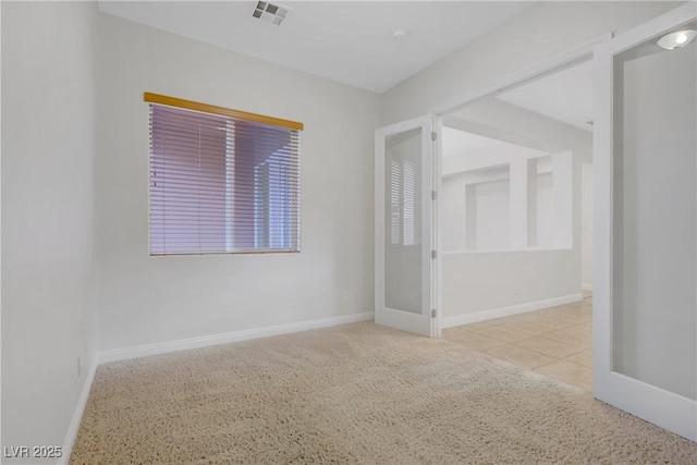 empty room featuring baseboards