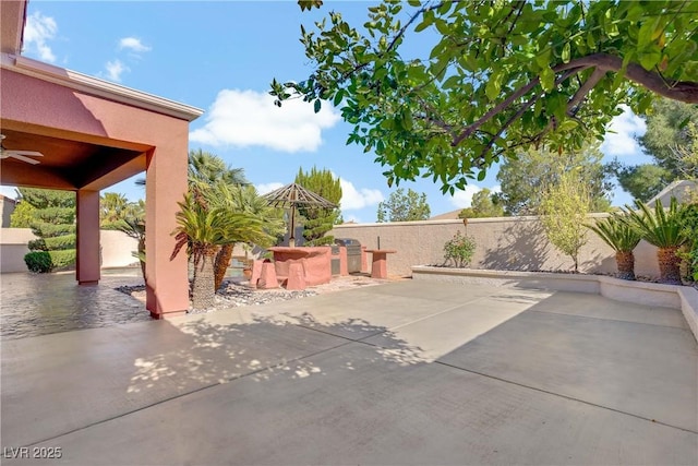 view of patio featuring ceiling fan and a fenced backyard