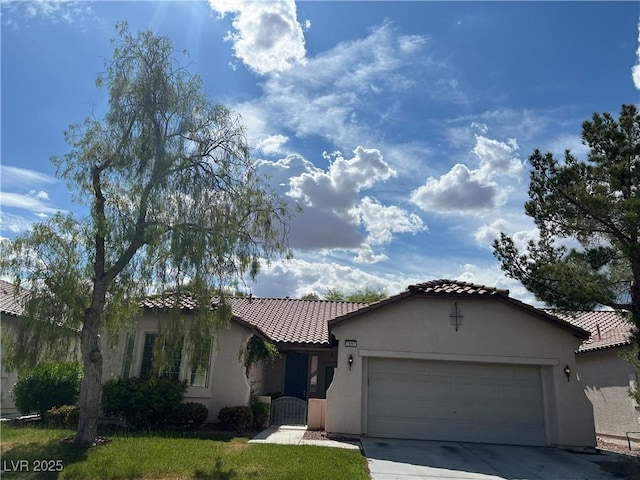 2855 Grande Valley Dr, Las Vegas, NV 89135 - view of front of house with a tile roof, stucco siding, an attached garage, and concrete driveway