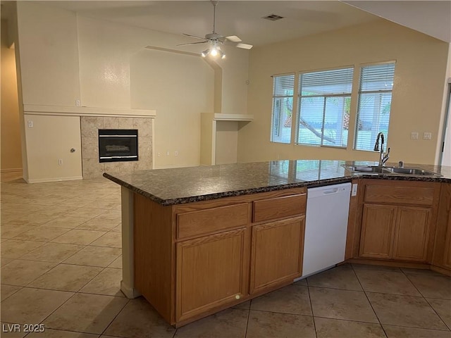 2855 Grande Valley Dr, Las Vegas, NV 89135 - kitchen featuring dishwasher, a sink, a fireplace, light tile patterned floors, and ceiling fan