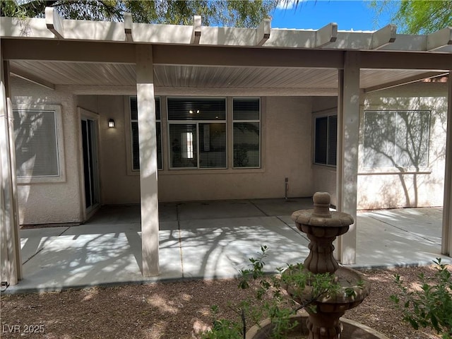 2855 Grande Valley Dr, Las Vegas, NV 89135 - back of house featuring a patio and stucco siding