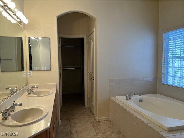 2855 Grande Valley Dr, Las Vegas, NV 89135 - full bath with tile patterned flooring, a bath, double vanity, and a closet