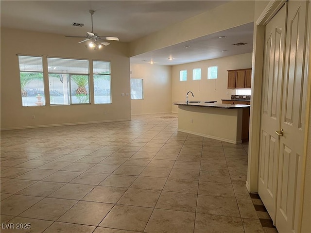 2855 Grande Valley Dr, Las Vegas, NV 89135 - kitchen with open floor plan, light tile patterned flooring, ceiling fan, a sink, and recessed lighting