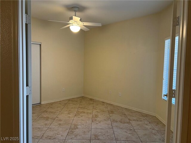 2855 Grande Valley Dr, Las Vegas, NV 89135 - empty room with ceiling fan, light tile patterned floors, and baseboards