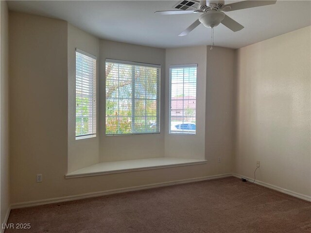 2855 Grande Valley Dr, Las Vegas, NV 89135 - empty room with carpet floors, plenty of natural light, baseboards, and a ceiling fan