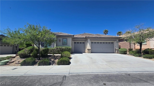 view of front facade featuring an attached garage, stucco siding, and concrete driveway