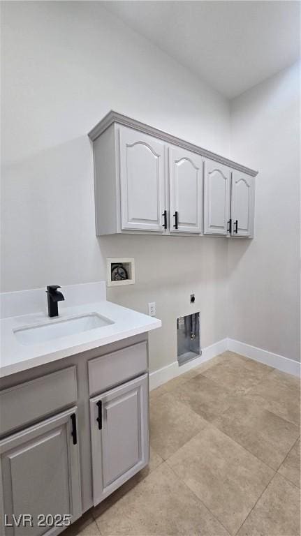 laundry room featuring cabinet space, hookup for a washing machine, electric dryer hookup, and baseboards