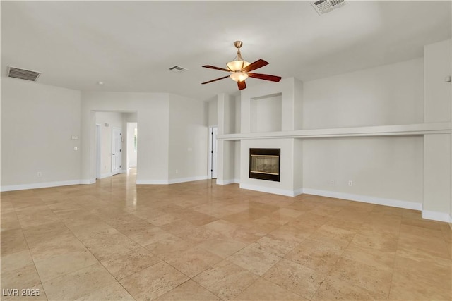 11621 La Mirago Pl, Las Vegas, NV 89138 - unfurnished living room with a ceiling fan, a glass covered fireplace, and baseboards