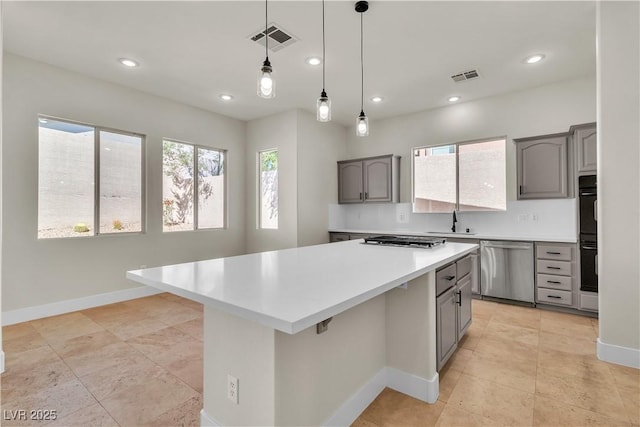 11621 La Mirago Pl, Las Vegas, NV 89138 - kitchen featuring stainless steel appliances, gray cabinets, light countertops, a center island, and recessed lighting