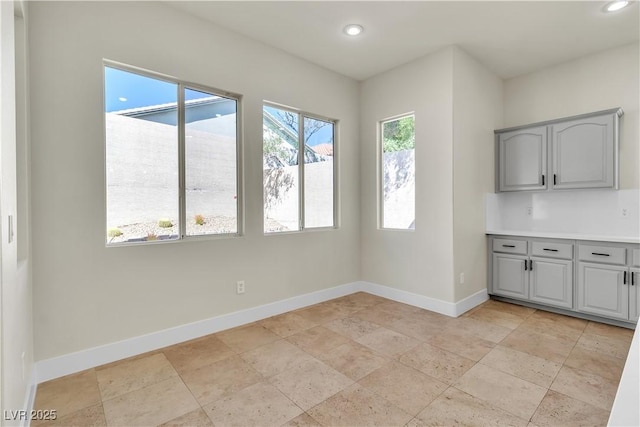 11621 La Mirago Pl, Las Vegas, NV 89138 - unfurnished dining area featuring baseboards, recessed lighting, and stone tile flooring