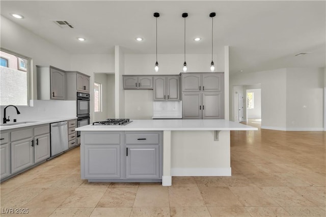 11621 La Mirago Pl, Las Vegas, NV 89138 - kitchen with gray cabinetry, appliances with stainless steel finishes, a sink, and recessed lighting