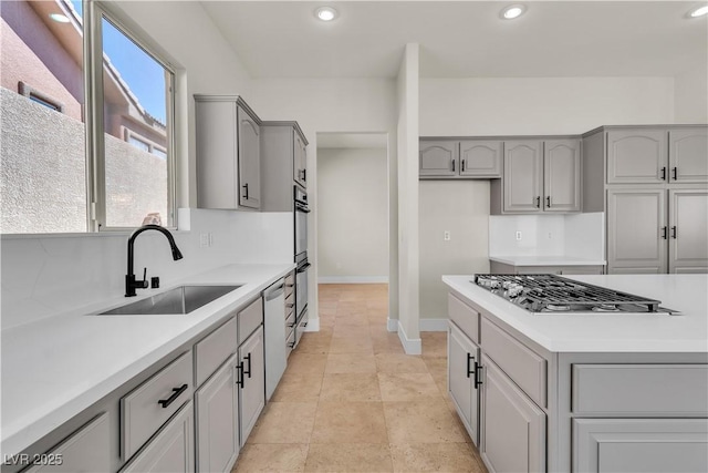 11621 La Mirago Pl, Las Vegas, NV 89138 - kitchen featuring gray cabinetry, a sink, appliances with stainless steel finishes, baseboards, and recessed lighting