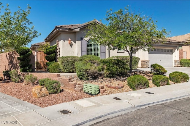 11621 La Mirago Pl, Las Vegas, NV 89138 - view of front of property with stucco siding, driveway, a garage, a gate, and a tile roof