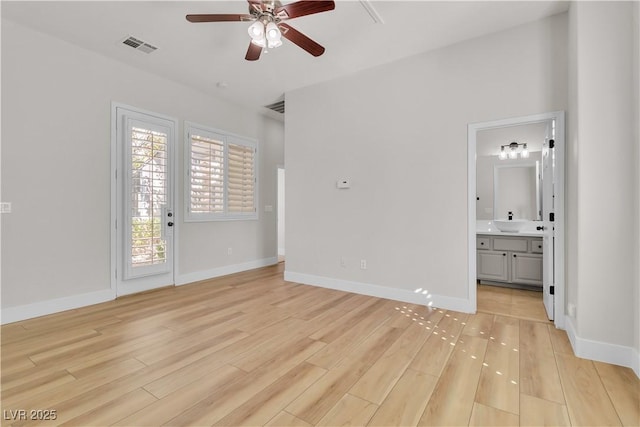 11621 La Mirago Pl, Las Vegas, NV 89138 - unfurnished bedroom featuring light wood-style floors, baseboards, connected bathroom, and access to outside