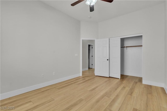11621 La Mirago Pl, Las Vegas, NV 89138 - unfurnished bedroom featuring wood finished floors, baseboards, a closet, and a ceiling fan