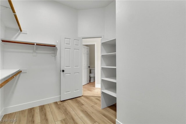 11621 La Mirago Pl, Las Vegas, NV 89138 - walk in closet featuring light wood-type flooring