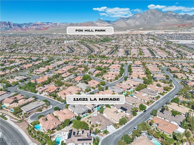 11621 La Mirago Pl, Las Vegas, NV 89138 - aerial view of property and surrounding area with mountains and nearby suburban area