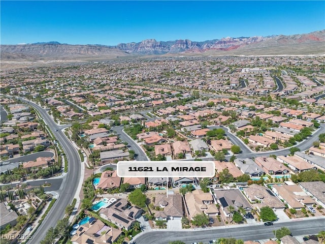 11621 La Mirago Pl, Las Vegas, NV 89138 - aerial view of property and surrounding area featuring a mountainous background and nearby suburban area