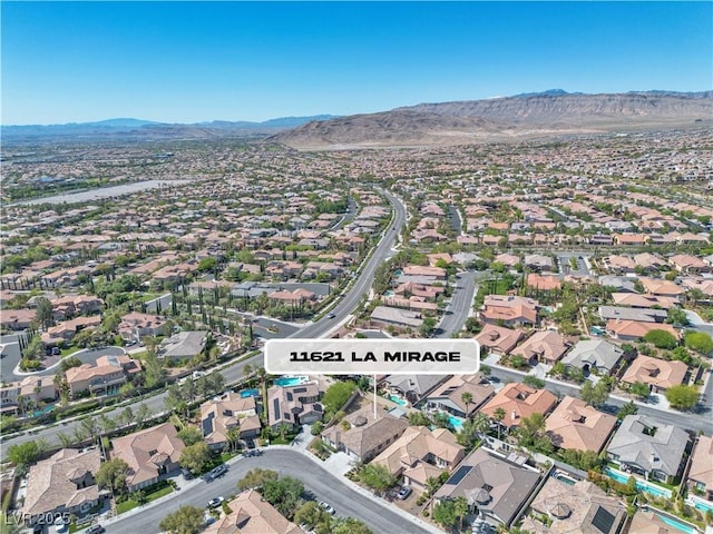 11621 La Mirago Pl, Las Vegas, NV 89138 - aerial view of property's location with a mountain backdrop and nearby suburban area