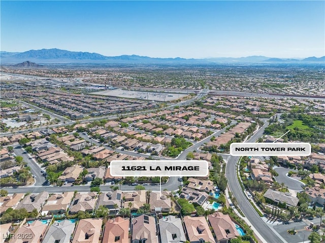 11621 La Mirago Pl, Las Vegas, NV 89138 - aerial view of property's location with a mountainous background and nearby suburban area