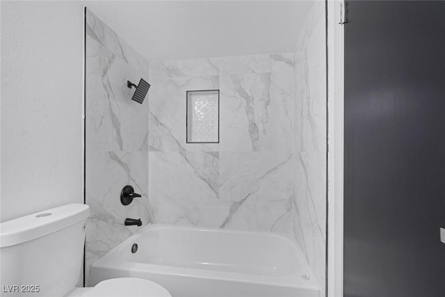 bathroom featuring toilet and shower / bathtub combination