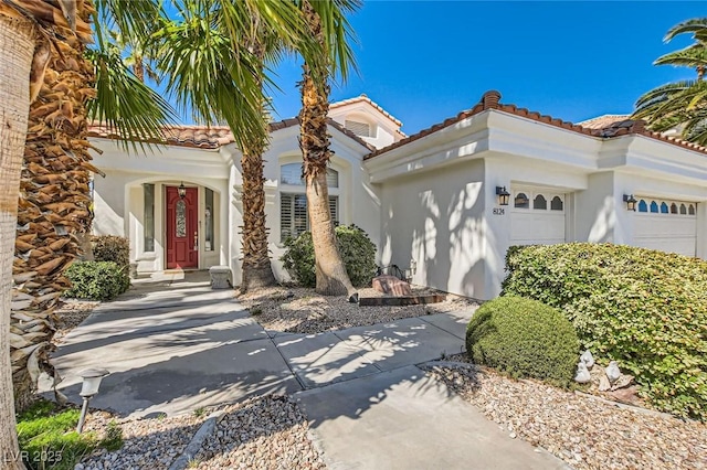 8124 Bay Harbor Dr, Las Vegas, NV 89128 - mediterranean / spanish home featuring an attached garage, stucco siding, and a tile roof