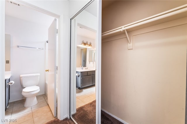 350 S Durango Dr Unit 108, Las Vegas, NV 89145 - bathroom featuring tile patterned floors, vanity, and toilet