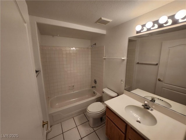 full bath featuring tile patterned floors, toilet,  shower combination, a textured ceiling, and vanity