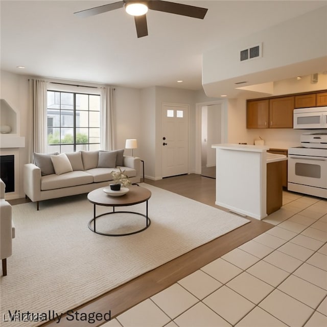 6908 Dorita Ave Unit 101, Las Vegas, NV 89108 - living room featuring ceiling fan, recessed lighting, and light wood-style flooring