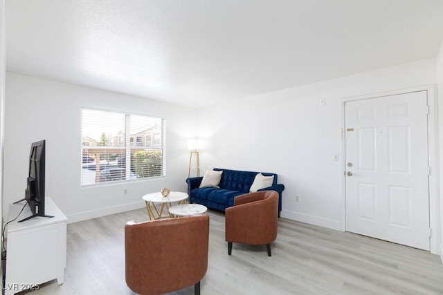 2300 E Silverado Ranch Blvd Unit 1165, Las Vegas, NV 89183 - living area featuring baseboards and light wood-type flooring