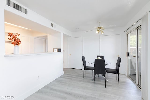 dining area with ceiling fan, wood finished floors, and baseboards