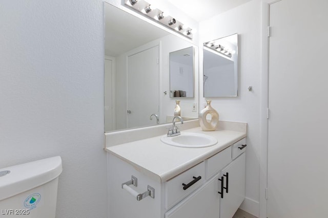 half bath with vanity and toilet