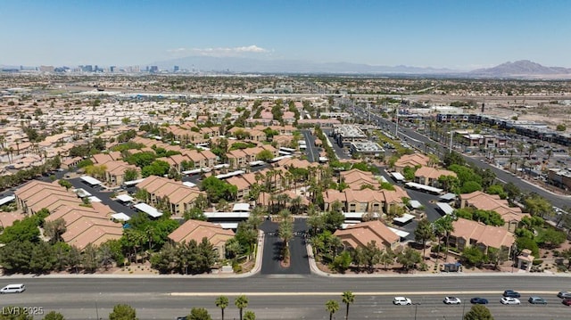 aerial view of residential area featuring a mountain backdrop