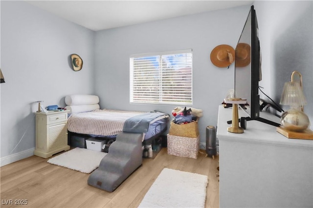bedroom featuring wood finished floors