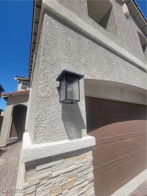 44 Moon Hill Dr, Henderson, NV 89011 - exterior view of stucco siding and stone siding