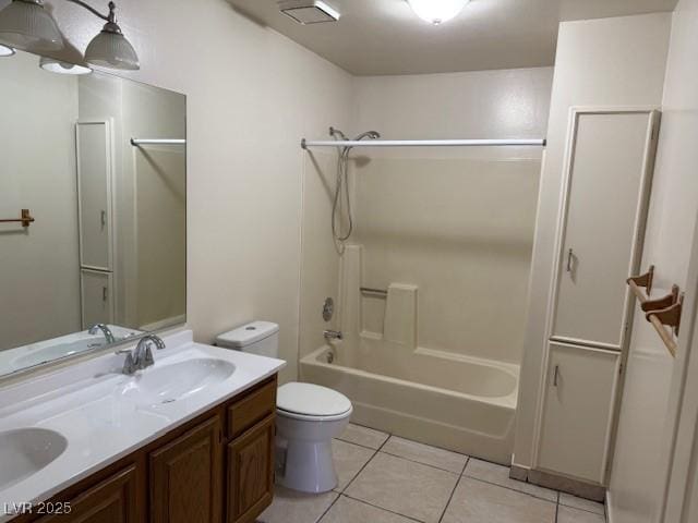 bathroom with tile patterned floors, toilet, double vanity, and shower / tub combination