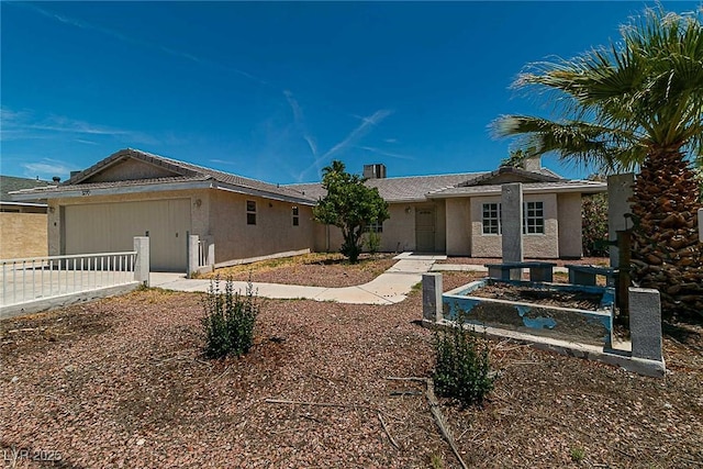5170 S Pearl St, Las Vegas, NV 89120 - ranch-style home featuring an attached garage, stucco siding, and driveway