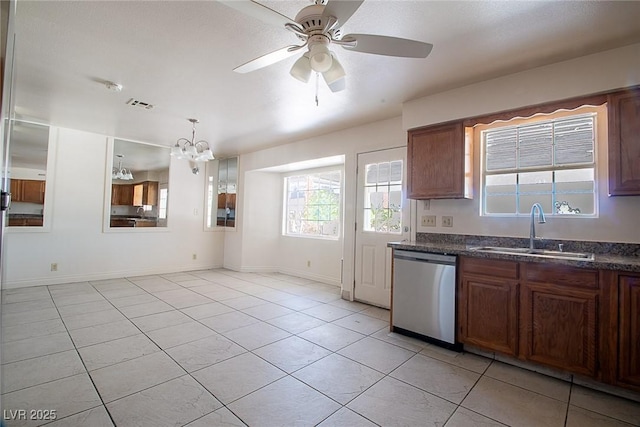 5170 S Pearl St, Las Vegas, NV 89120 - kitchen with dishwasher, a sink, light tile patterned floors, and a chandelier