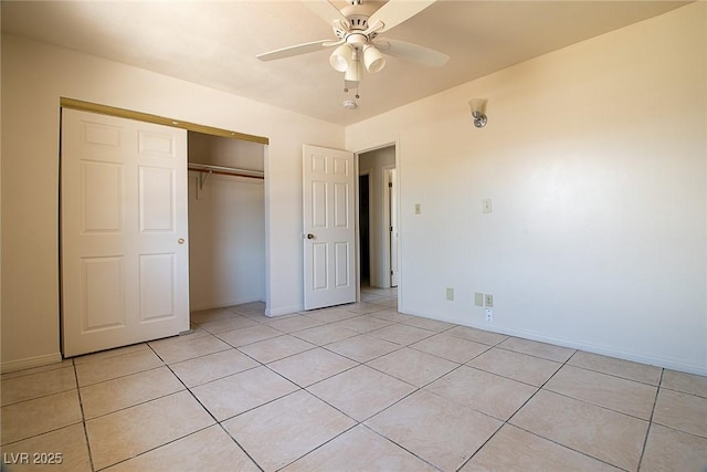 5170 S Pearl St, Las Vegas, NV 89120 - unfurnished bedroom with a closet, light tile patterned floors, baseboards, and ceiling fan