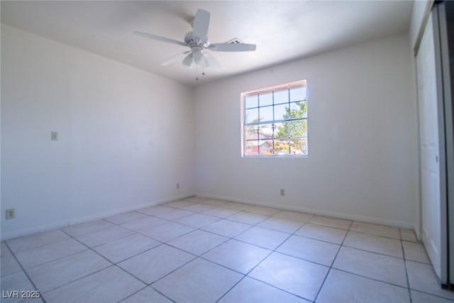 5170 S Pearl St, Las Vegas, NV 89120 - spare room featuring ceiling fan, light tile patterned flooring, and baseboards