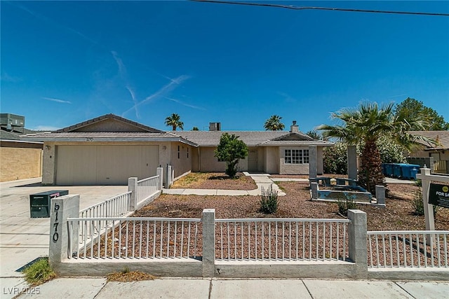 5170 S Pearl St, Las Vegas, NV 89120 - single story home featuring a fenced front yard, a garage, driveway, and central AC