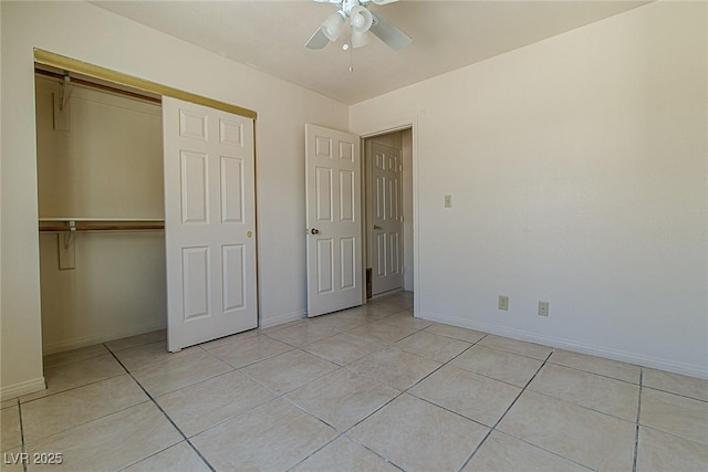 5170 S Pearl St, Las Vegas, NV 89120 - unfurnished bedroom with a closet, light tile patterned floors, and baseboards