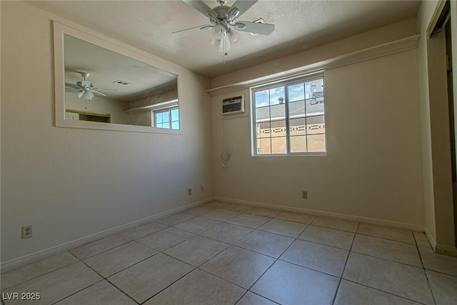 5170 S Pearl St, Las Vegas, NV 89120 - unfurnished room with a ceiling fan, light tile patterned floors, baseboards, and an AC wall unit