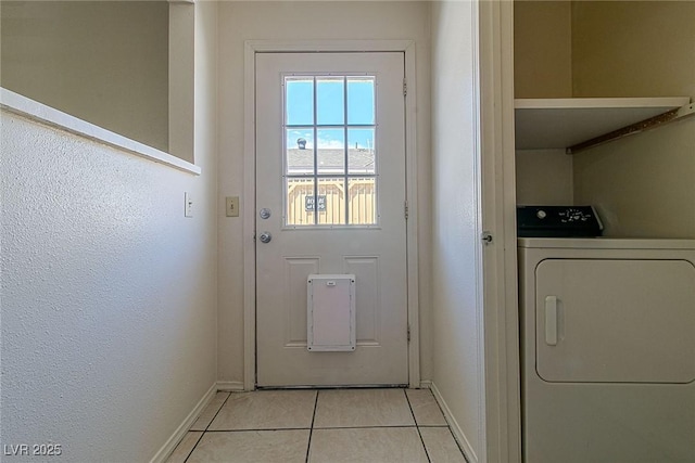 5170 S Pearl St, Las Vegas, NV 89120 - clothes washing area with washer / dryer, baseboards, and light tile patterned flooring