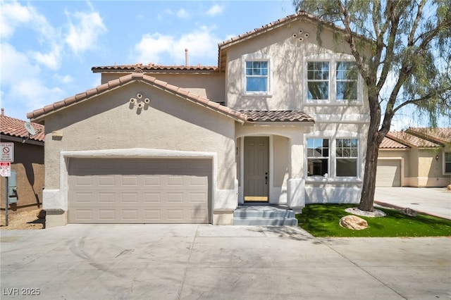 529 Fork Mesa Ct, Henderson, NV 89015 - mediterranean / spanish-style home featuring stucco siding, concrete driveway, a garage, and a tiled roof